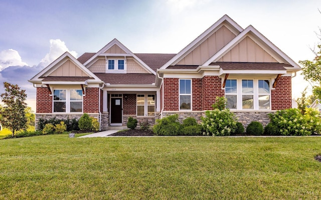 3779 Sturbridge Way, Pierce Twp, OH 45245 - craftsman-style home with stone siding, a front yard, board and batten siding, and a shingled roof
