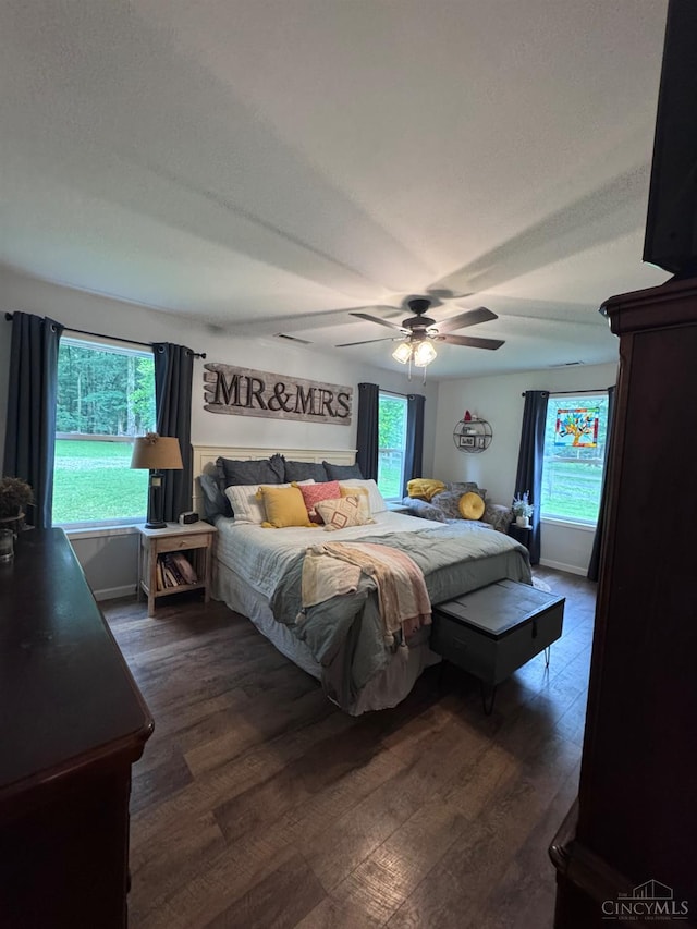 9063 Morrow Woodville Rd, Harlan Twp, OH 45162 - bedroom with dark wood-style floors and ceiling fan