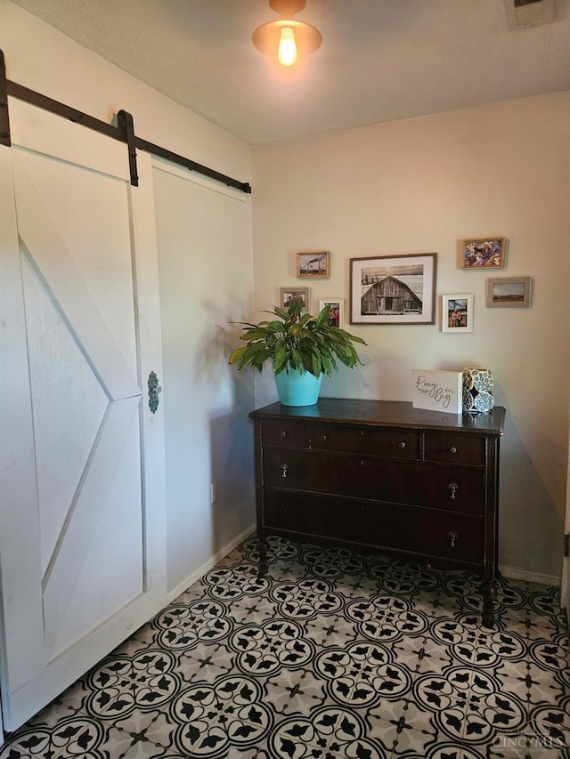9063 Morrow Woodville Rd, Harlan Twp, OH 45162 - foyer featuring a barn door and baseboards