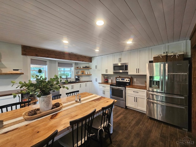 9063 Morrow Woodville Rd, Harlan Twp, OH 45162 - kitchen with appliances with stainless steel finishes, open shelves, white cabinetry, dark wood-type flooring, and recessed lighting