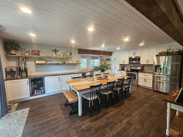 9063 Morrow Woodville Rd, Harlan Twp, OH 45162 - kitchen featuring stainless steel appliances, open shelves, beverage cooler, white cabinets, and wood ceiling