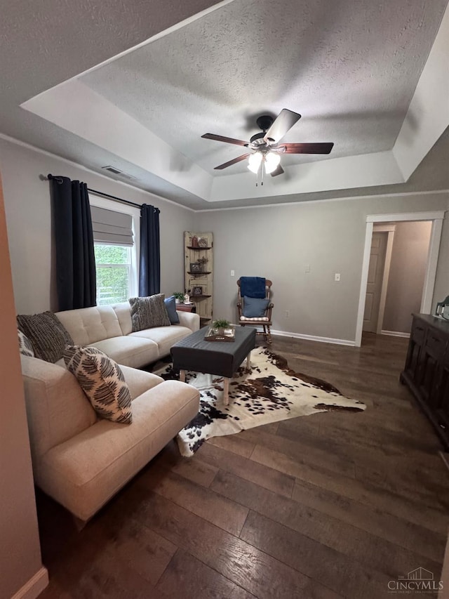 9063 Morrow Woodville Rd, Harlan Twp, OH 45162 - living room featuring a raised ceiling, hardwood / wood-style floors, a ceiling fan, and a textured ceiling