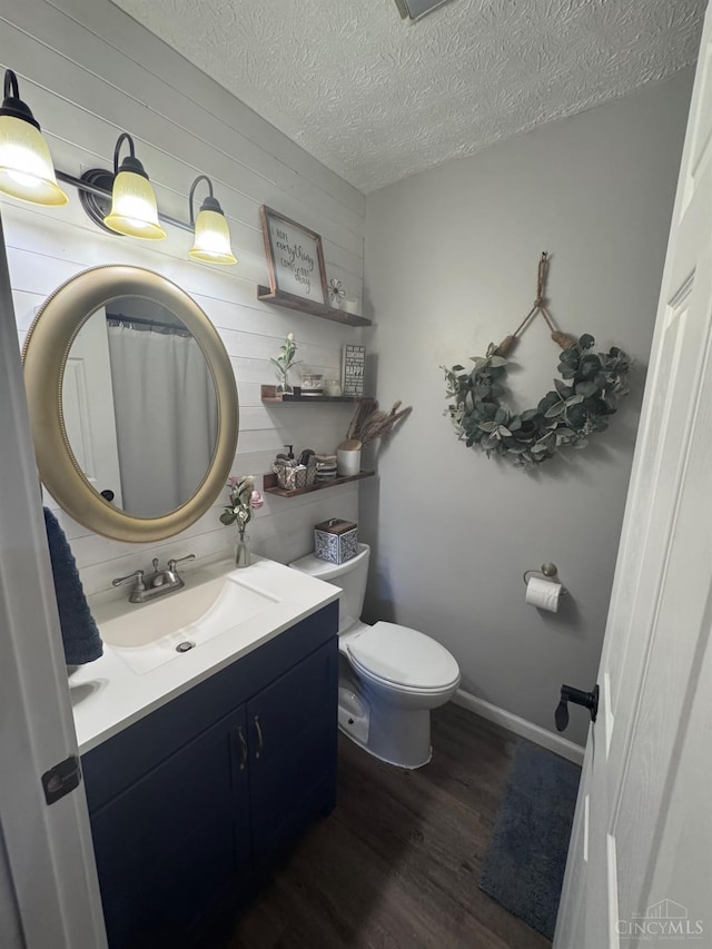 9063 Morrow Woodville Rd, Harlan Twp, OH 45162 - full bathroom with wood finished floors, vanity, and a textured ceiling