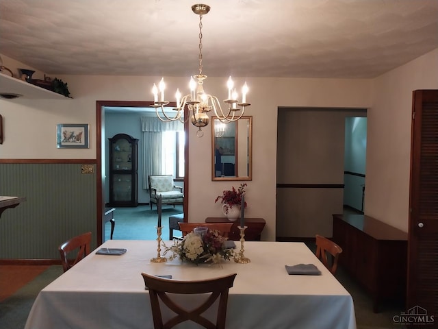 13353 State Route 28 W, Greenfield, OH 45123 - dining space featuring a chandelier and a wainscoted wall