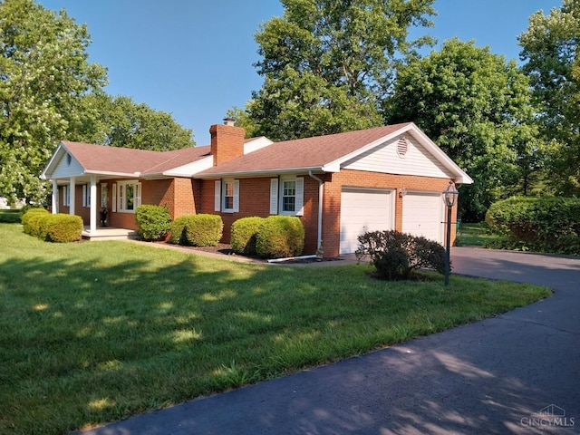 13353 State Route 28 W, Greenfield, OH 45123 - single story home featuring a chimney, an attached garage, a front yard, brick siding, and concrete driveway