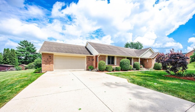 1900 Lani Dr, Washington Twp, OH 45320 - ranch-style house featuring brick siding, an attached garage, concrete driveway, and a front yard