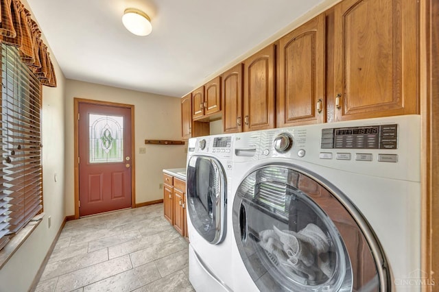 1900 Lani Dr, Washington Twp, OH 45320 - laundry room featuring washing machine and dryer and cabinet space
