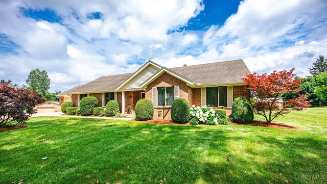 1900 Lani Dr, Washington Twp, OH 45320 - single story home featuring brick siding, a front lawn, and a shingled roof