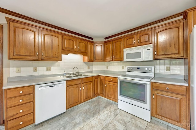 1900 Lani Dr, Washington Twp, OH 45320 - kitchen with white appliances, brown cabinets, tasteful backsplash, and light countertops