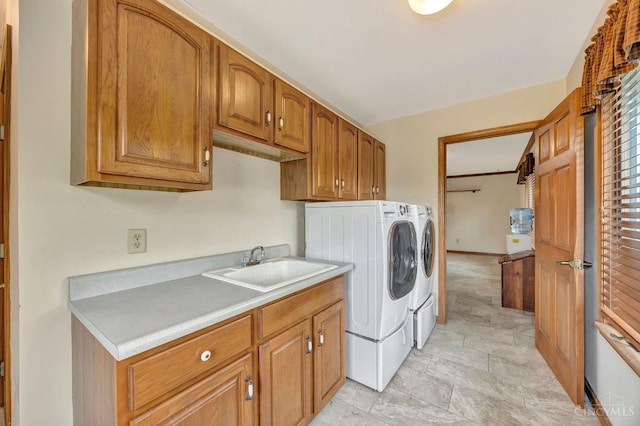 1900 Lani Dr, Washington Twp, OH 45320 - laundry room featuring washer and dryer, cabinet space, and stone finish floors