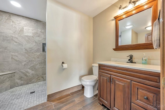 1900 Lani Dr, Washington Twp, OH 45320 - bathroom with vanity, a tile shower, and wood finish floors