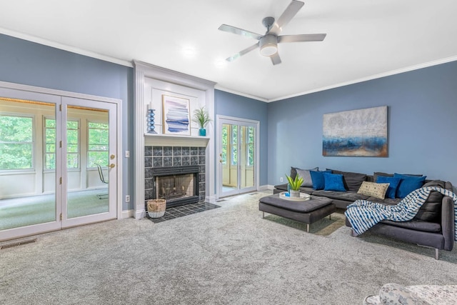 8551 Trillium Ridge Ln, Anderson Twp, OH 45255 - living area with crown molding, carpet floors, a ceiling fan, and a tile fireplace