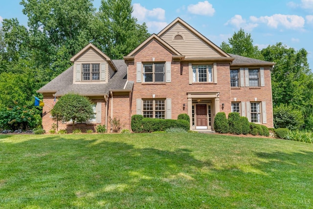 8551 Trillium Ridge Ln, Anderson Twp, OH 45255 - view of front of house featuring a front lawn, brick siding, and a shingled roof