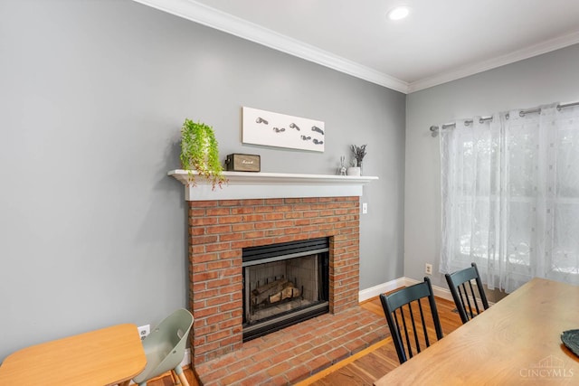 8551 Trillium Ridge Ln, Anderson Twp, OH 45255 - living room with wood finished floors, a brick fireplace, ornamental molding, and recessed lighting