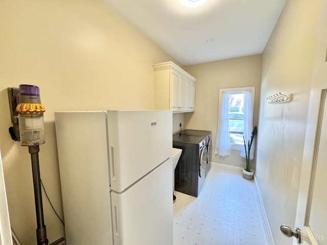 8551 Trillium Ridge Ln, Anderson Twp, OH 45255 - laundry area with separate washer and dryer, cabinet space, and light flooring