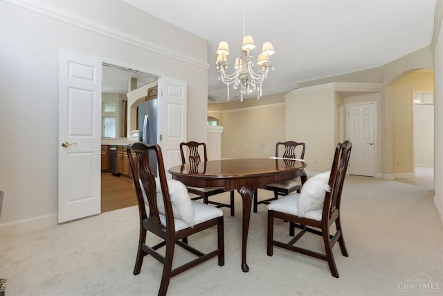 1301 Laurel Brook Way, Lebanon, OH 45036 - dining space with arched walkways, light carpet, and a chandelier