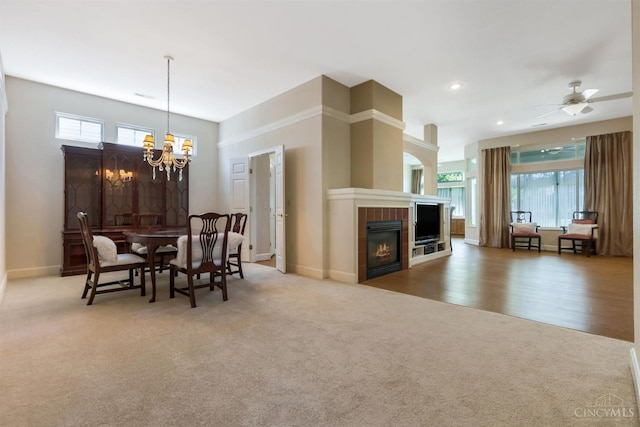 1301 Laurel Brook Way, Lebanon, OH 45036 - carpeted dining space featuring a chandelier, a tiled fireplace, ceiling fan, and recessed lighting