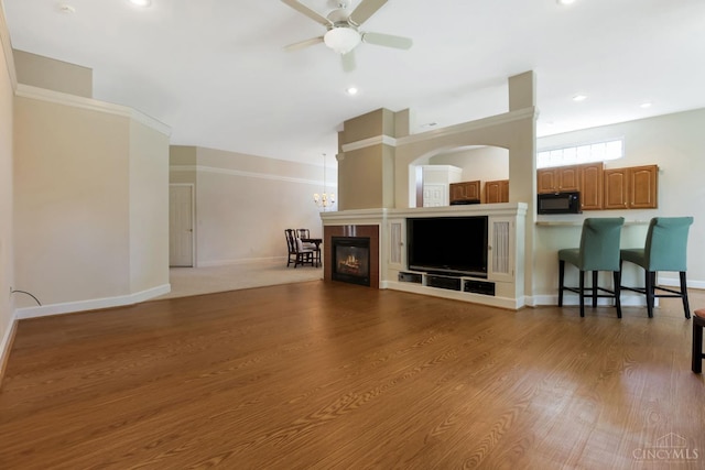 1301 Laurel Brook Way, Lebanon, OH 45036 - living area with ceiling fan, wood finished floors, a glass covered fireplace, and recessed lighting