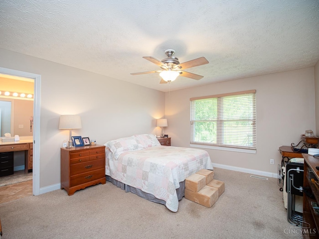 7854 Cape Cod Ct, West Chester, OH 45069 - carpeted bedroom with ceiling fan, ensuite bath, and a textured ceiling