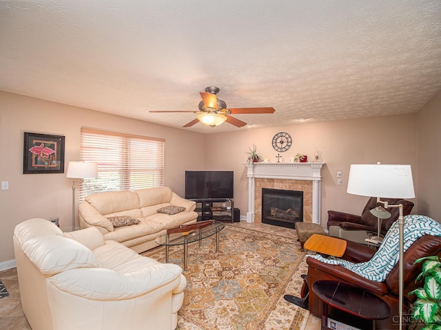 7854 Cape Cod Ct, West Chester, OH 45069 - living room featuring ceiling fan, a fireplace, and a textured ceiling