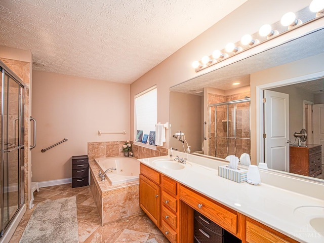 7854 Cape Cod Ct, West Chester, OH 45069 - bathroom featuring a stall shower, double vanity, a whirlpool tub, and a textured ceiling