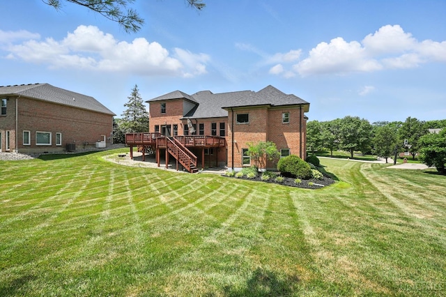 7066 Hearthside Ct, Liberty Twp, OH 45011 - rear view of property featuring a deck, stairway, brick siding, and a yard