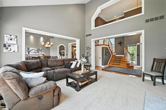 7066 Hearthside Ct, Liberty Twp, OH 45011 - living room with a high ceiling, a chandelier, and stairway