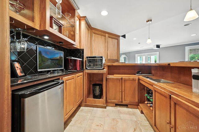 7066 Hearthside Ct, Liberty Twp, OH 45011 - kitchen featuring refrigerator, tasteful backsplash, brown cabinetry, hanging light fixtures, and recessed lighting