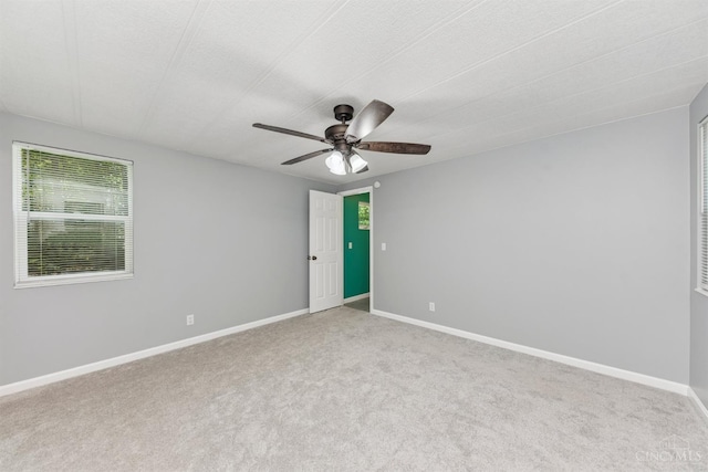 14697 Bodman Rd, Sterling Twp, OH 45154 - carpeted spare room featuring a ceiling fan and baseboards