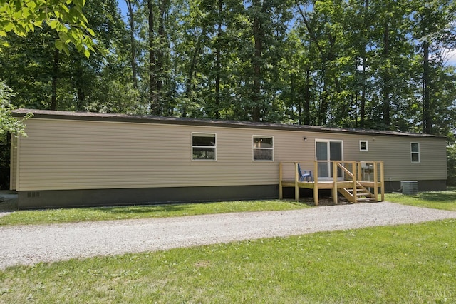 14697 Bodman Rd, Sterling Twp, OH 45154 - rear view of house featuring a yard, a deck, and crawl space