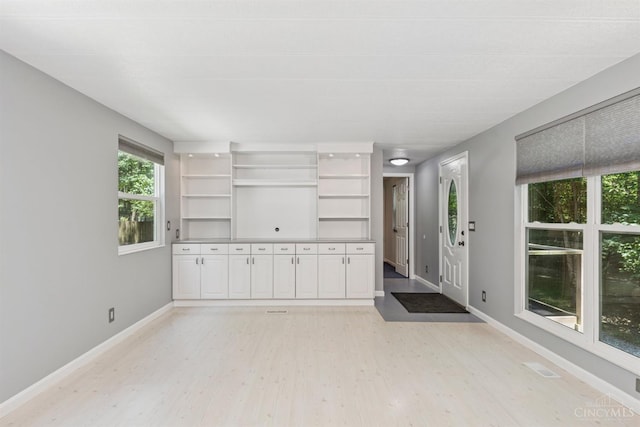 14697 Bodman Rd, Sterling Twp, OH 45154 - empty room with light wood-style floors and baseboards