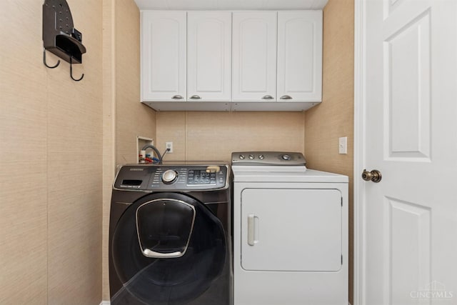 14697 Bodman Rd, Sterling Twp, OH 45154 - laundry room featuring cabinet space and independent washer and dryer