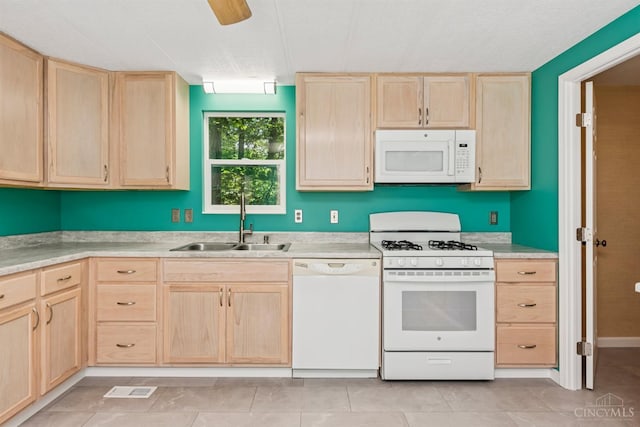 14697 Bodman Rd, Sterling Twp, OH 45154 - kitchen featuring white appliances, light brown cabinets, light countertops, and light tile patterned flooring
