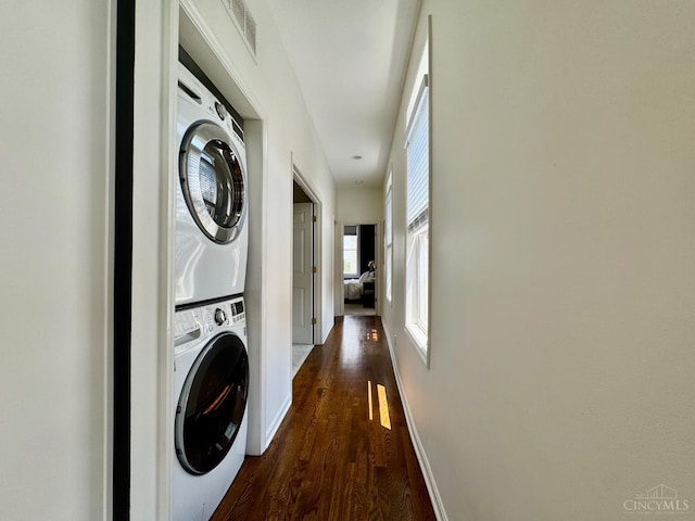 955 Pavilion St Unit 4, Cincinnati, OH 45202 - washroom with stacked washer / dryer and dark wood finished floors