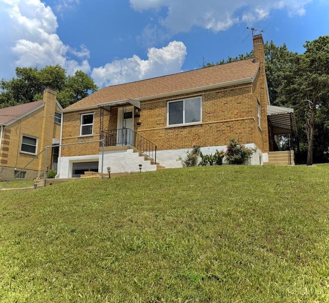 5424 Delhi Rd, Delhi Twp, OH 45238 - ranch-style house featuring brick siding, a chimney, and a front yard
