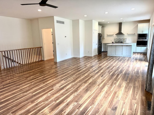 559 Foster-Maineville Rd, Hamilton Twp, OH 45039 - unfurnished living room with a ceiling fan, wood finished floors, and recessed lighting