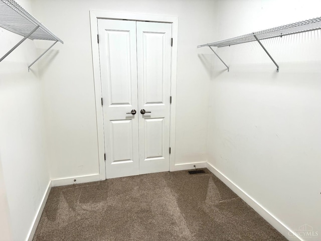 559 Foster-Maineville Rd, Hamilton Twp, OH 45039 - walk in closet with dark carpet