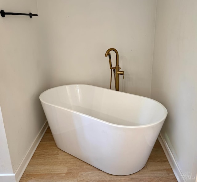 559 Foster-Maineville Rd, Hamilton Twp, OH 45039 - bathroom view of a freestanding bath and wood finished floors