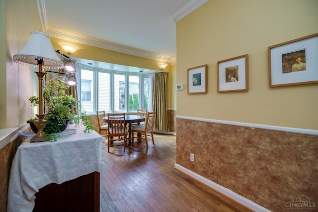 8012 Euclid Ave, Madeira, OH 45243 - dining space with hardwood / wood-style flooring, ornamental molding, and a wainscoted wall