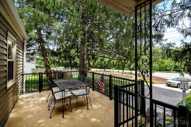 8012 Euclid Ave, Madeira, OH 45243 - view of patio / terrace with outdoor dining space and view of wooded area