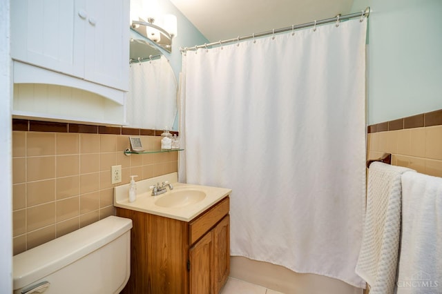 8012 Euclid Ave, Madeira, OH 45243 - bathroom featuring tile walls, vanity, and a wainscoted wall