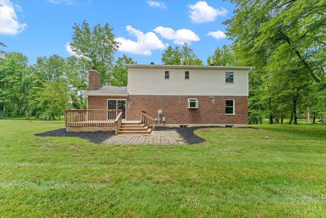 2535 Crane Schoolhouse Rd, Tate Twp, OH 45106 - back of property featuring a patio, a deck, a chimney, and brick siding