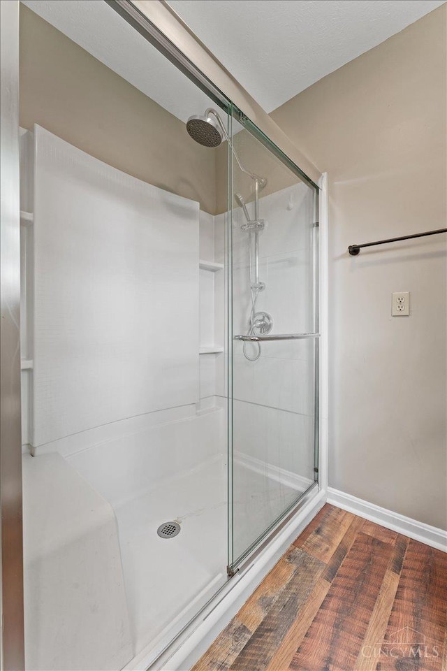 2535 Crane Schoolhouse Rd, Tate Twp, OH 45106 - bathroom featuring a shower stall and wood finished floors