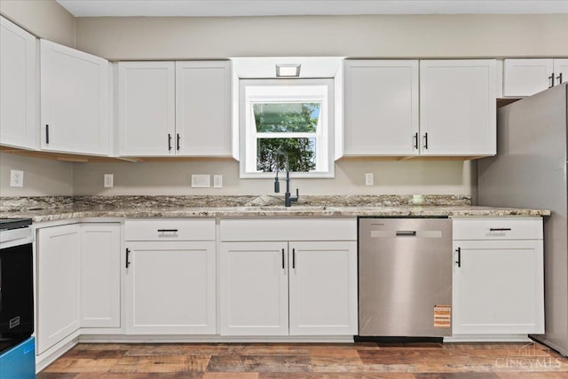 2535 Crane Schoolhouse Rd, Tate Twp, OH 45106 - kitchen featuring stainless steel appliances, white cabinetry, and light stone countertops