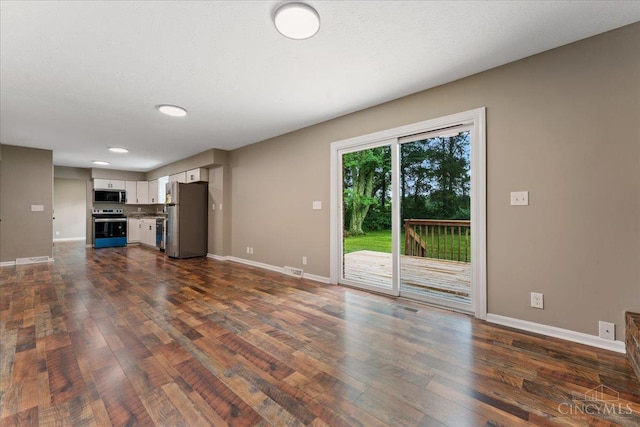 2535 Crane Schoolhouse Rd, Tate Twp, OH 45106 - unfurnished living room with dark wood-style flooring and baseboards