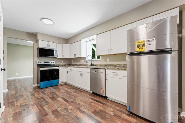 2535 Crane Schoolhouse Rd, Tate Twp, OH 45106 - kitchen with stainless steel appliances, white cabinets, dark wood-style flooring, and light stone countertops