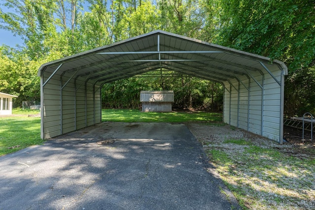 989 E Ogden Rd, Adams Twp, OH 45177 - view of parking with asphalt driveway and a detached carport