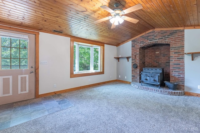 989 E Ogden Rd, Adams Twp, OH 45177 - unfurnished living room featuring wood ceiling, a wood stove, plenty of natural light, ceiling fan, and carpet floors