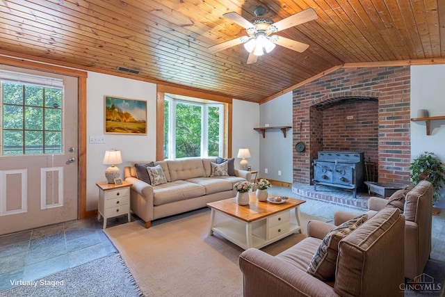 989 E Ogden Rd, Adams Twp, OH 45177 - living room with healthy amount of natural light, wooden ceiling, a ceiling fan, vaulted ceiling, and a wood stove