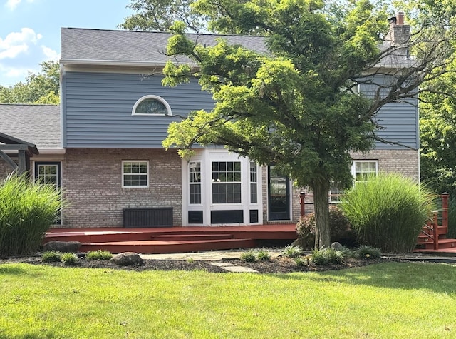 6330 Branch Hill Miamiville Rd, Miami Twp, OH 45140 - rear view of house with a deck, brick siding, a yard, and roof with shingles